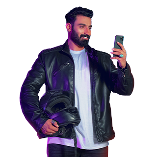 The image featuring man holding a smartphone and a helmet.